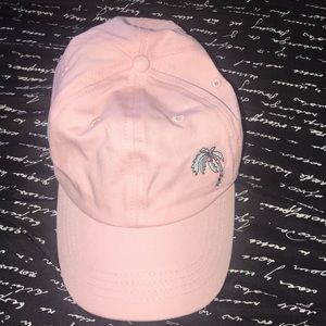 Pink hat with palm tree and “shady” detailing.